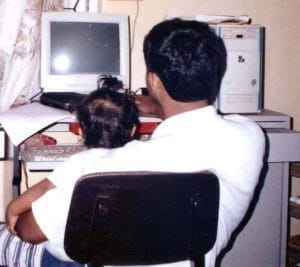 Son and me sitting in front of our first PC