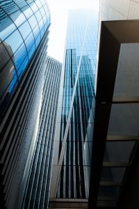 glass facades of neo futuristic skyscrapers