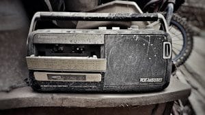 grey and black Panasonic RX-M50M3 transistor radio on grey surface