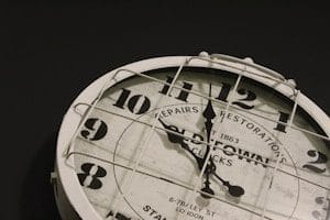 analog clock at 9:59