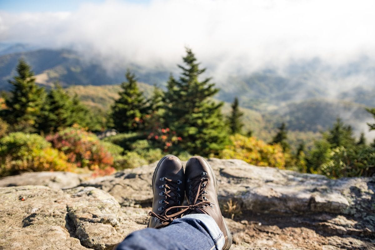 A person enjoying the view from the top of a hill