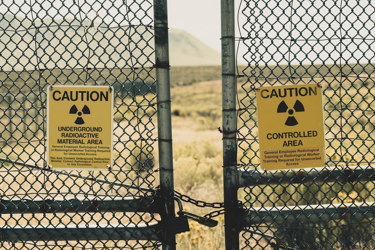 a couple of radiation signs on a fence
